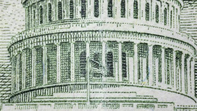 Close-up shot of various parts of a fifty dollar bill