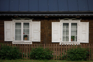 Fototapeta premium Traditional lithuanian house detail - windows with traditional ornaments