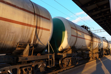 railway tank cars, railroad station platform, concept of freight transportation by rail, industrial...