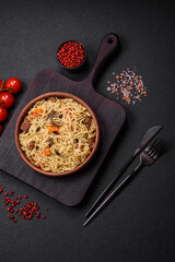 Delicious Uzbek pilaf with chicken, carrots, barberry, spices and herbs