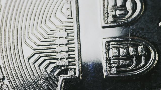 bitcoin coins lie on a dollar bill close-up