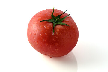 red fresh tomato on a white background, studio shooting 1