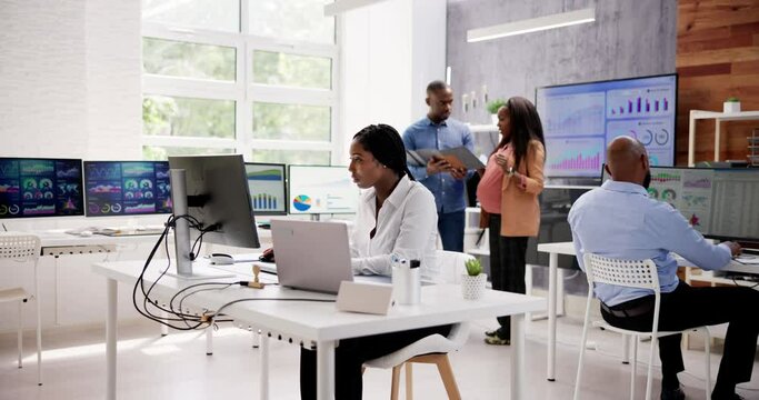 African Financial Data Analysts Using Dashboard On Screens