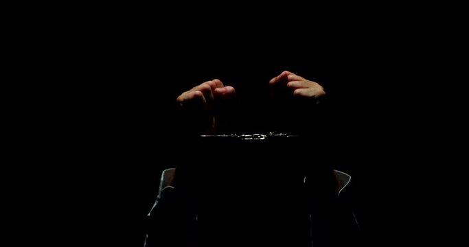 Shrouded Guilt. The Haunting Desperation of a Handcuffed Businessman, Clad in Darkness, Conveying a Raw Mix of Sin, Innocence, and Utter Hopelessness.