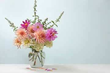 Beautiful dahlia flowers in a vase, abstract floral arrangement, autumn background with place for text, minimal holiday concept, still life, postcard. Happy birthday greetings © Светлана Балынь