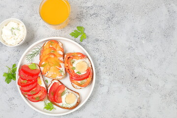 Healthy breakfast with ingredients. Diet vegan mini sandwiches with soft cottage cheese and fresh vegetables, cucumber, tomato, sweet pepper, egg and spices, healthy and natural food concept,
