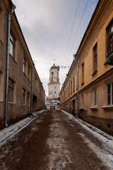 Street of old town with view of old Clock Tower. Belfry of Vyborg Cathedral, Vyborg, Russia. High quality photo