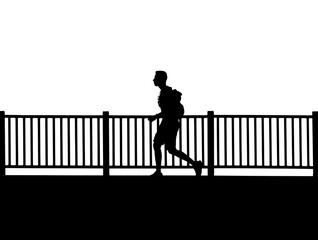 silhouette of a person on a bridge