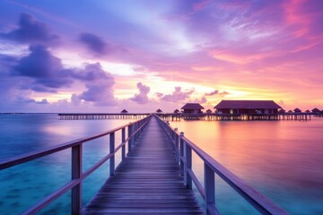 Fototapeta na wymiar Luxury Haven in Twilight Glow: Beautiful Island Sunset Panorama with Illuminated Resort Villas 