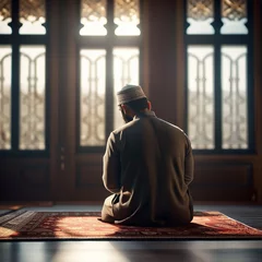 Foto op Plexiglas Muslim man sitting on prayer mat in mosque © Murad Mohd Zain