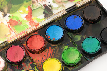 Watercolor paints table on the white background.