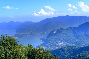 aerial view of Como Lake landscape in beautiful summer day, trees, water and mountains, Italy, Europe, concept summer vacation, travel and enjoyment