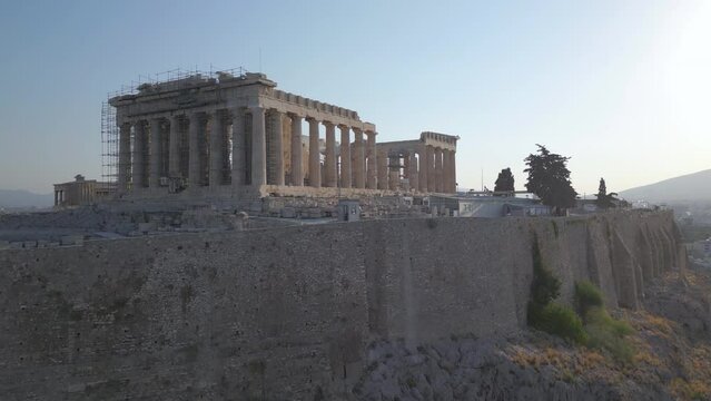 day rising view of Parthenon atop Acropolis in Athens Greece