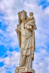 Fototapeta na wymiar The Virgin of Paris or Notre-Dame de Paris is a near life-size stone statue. France