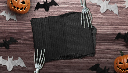 Top view of Halloween decoration desk with a piece of cardboard in the middle