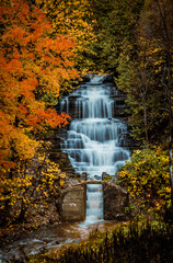 Princess Louise Falls during autumn, waterfall surrounded by fall foliage in Orleans, Ottawa, Ontario, Canada. Photo taken in October 2021. 