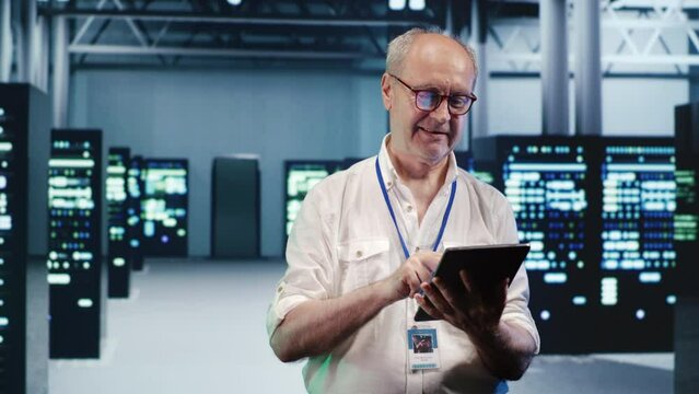 Happy computer scientist expertly managing data while navigating through industrial blade servers. Cheerful system administrator ensuring flawless cybersecurity defence, optimizing systems