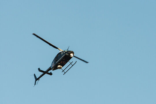 The WSOC Channel 9 Eyewitness News helicopter in Charlotte isolated against a blue sky with copy space