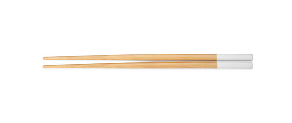 Pair of wooden chopsticks isolated on white, top view