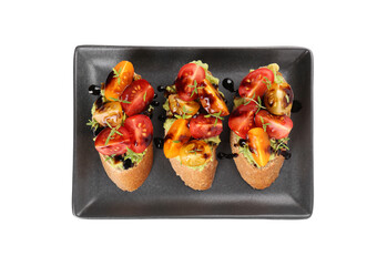 Delicious bruschettas with avocado, tomatoes and balsamic vinegar isolated on white, top view