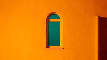 Window of the mosque in turkey against the background of a white wall