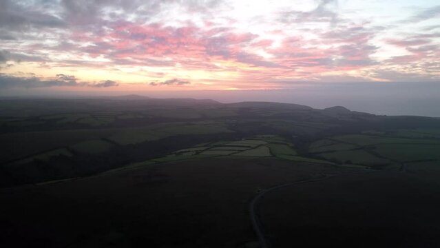 Sunset over Moorland and Farms from a drone, Exmoor National Park, Devon, England, Europe