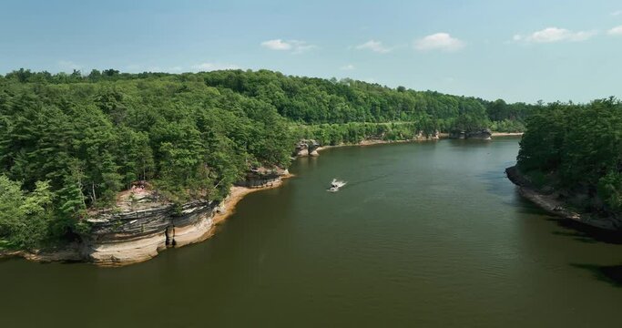 Wisconsin River at Wisconsin Dells with rock formations, aerial along the river with boat on the water