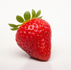 fresh single strawberry on the table with a white background