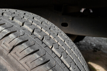 Light truck tire in natural sunlight.