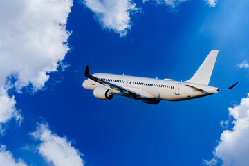 Passengers Commercial airplane flying above dramatic clouds. Concept of fast travel, holidays and business. Commercial transportation concept