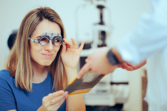 Patient Wearing a Trial Frame Squinting for an Eyesight Test. Doctor consulting a patient in ophthalmology clinic
