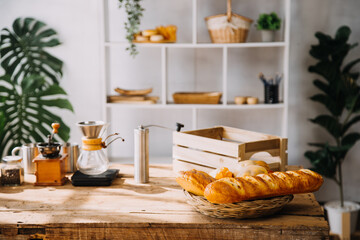 Happy young adult couple making breakfast and drinking coffee together in cozy home kitchen in morning at home. Preparing meal and smiling. Lifestyle, leisure and Love concept.