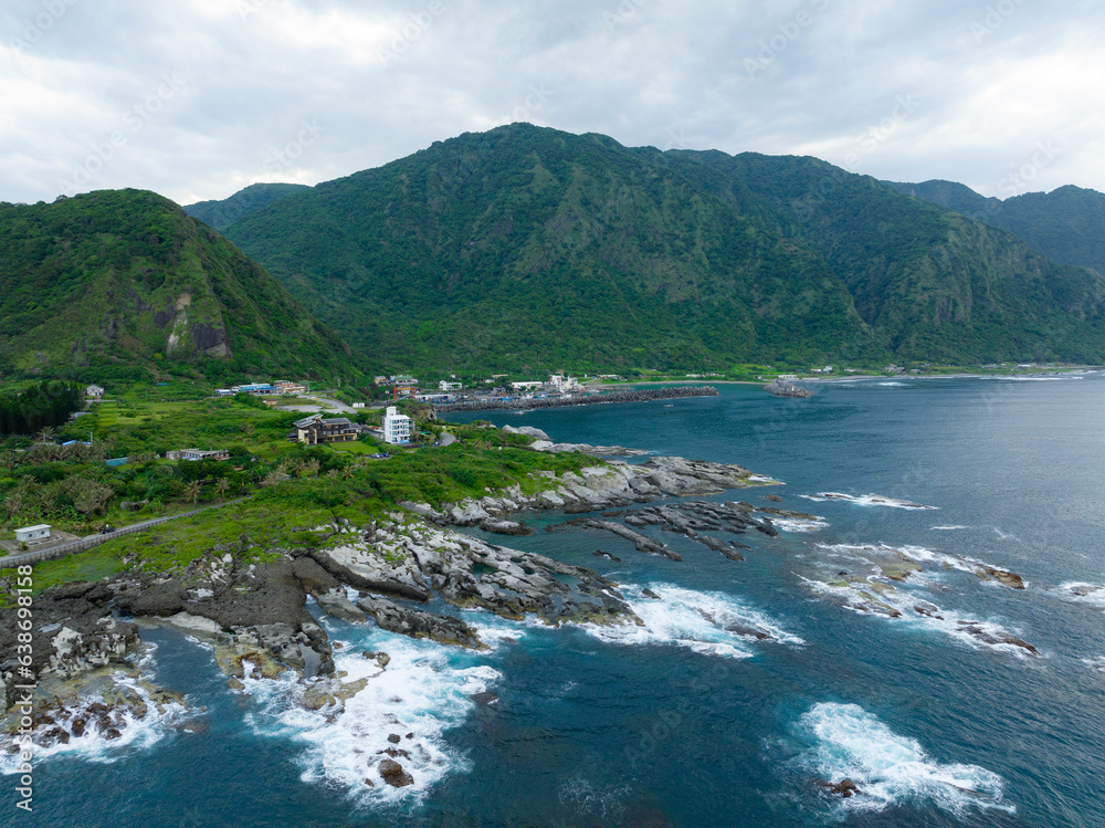 Sticker drone fly over taiwan hualien rice field over the sea in fengbin township, shitiping coastal stone s