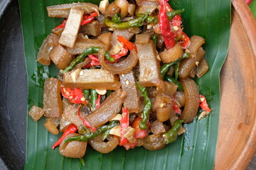 Oseng Kikil Sapi is stir-fried beef leg with spices, red chilies, green chilies, bay leaves, and...