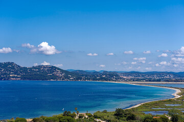 Fototapeta premium Aerial view from Giens peninsula on a sunny spring day with Mediterranean Sea and mountain panorama in the background. Photo taken June 8th, 2023, Giens, Hyères, France.