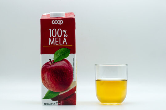 Bologna - Italy - August 23, 2023: Italian Coop apple fruit juice. Bottle label, packaging design in cardboard tetrapack.