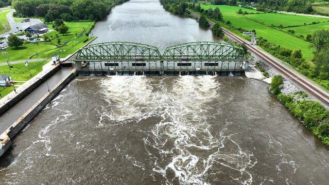 Still look at a green Loch Bridge on the Mohawk River.