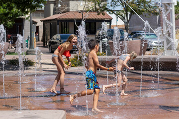 Young kids playing in water on splashpad
