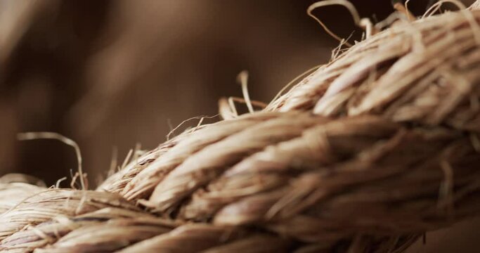 Micro video of close up of brown string with copy space