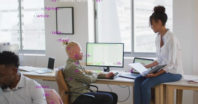 Animation of multicolored computer language, diverse coworkers discussing reports on desktop