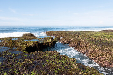 Sawarna beach,west Java,Indonesia, beautiful beach with coral reefs dotted with greenery 