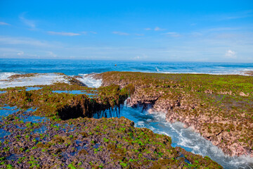 Sawarna beach,west Java,Indonesia, beautiful beach with coral reefs dotted with greenery 