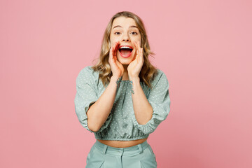 Young promoter happy woman she wear casual clothes scream sharing hot news about sales discount with hands near mouth isolated on plain pastel light pink background studio portrait. Lifestyle concept.