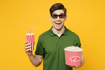 Young overjoyed cool fun happy man in 3d glasses green t-shirt casual clothes watch movie film...