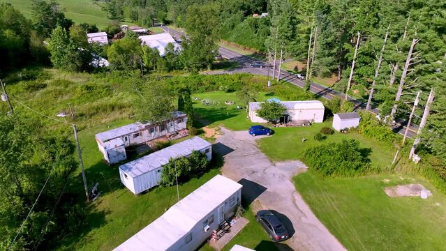 aerial pullout over trailer park in appalachia near fries virginia