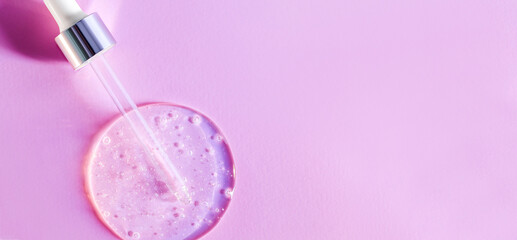 pipette drops of serum on pink background