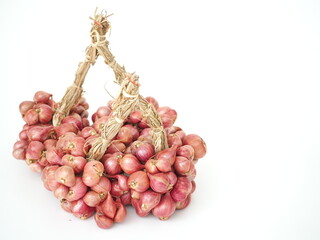 Shallot onions on white background. Fresh shallot. Closeup photo, blurred.