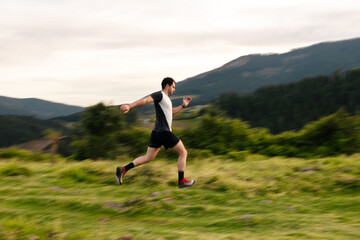 Young man running in the mountains