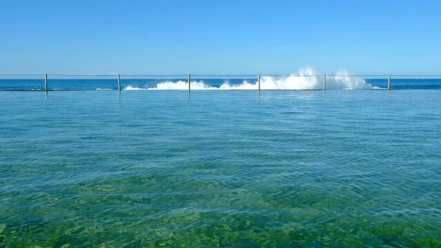 Rock pool, ocean pool, calm sunny day, summer, blue sky. Cronulla beach, Sydney, Australia.