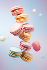 Obraz premium Different types of macaroons in motion falling on a colorful background